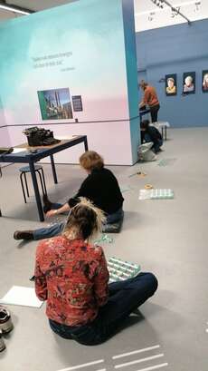 Sticking guiding lines in the new exhibition.