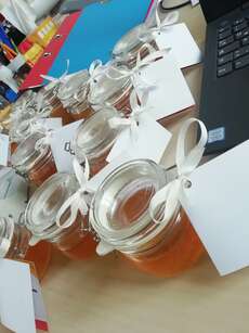 preparing honey glasses as christmas presents for partners of my organisation