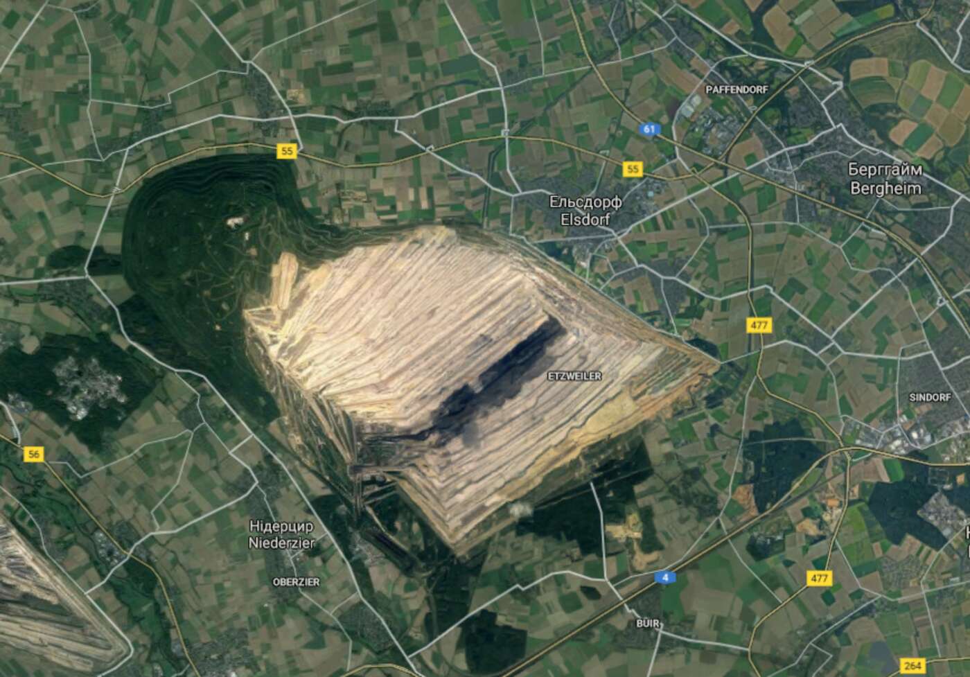 The satellite image of the Hambach that shows opencast mine and small forest