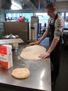 Oleksandr preparing dough